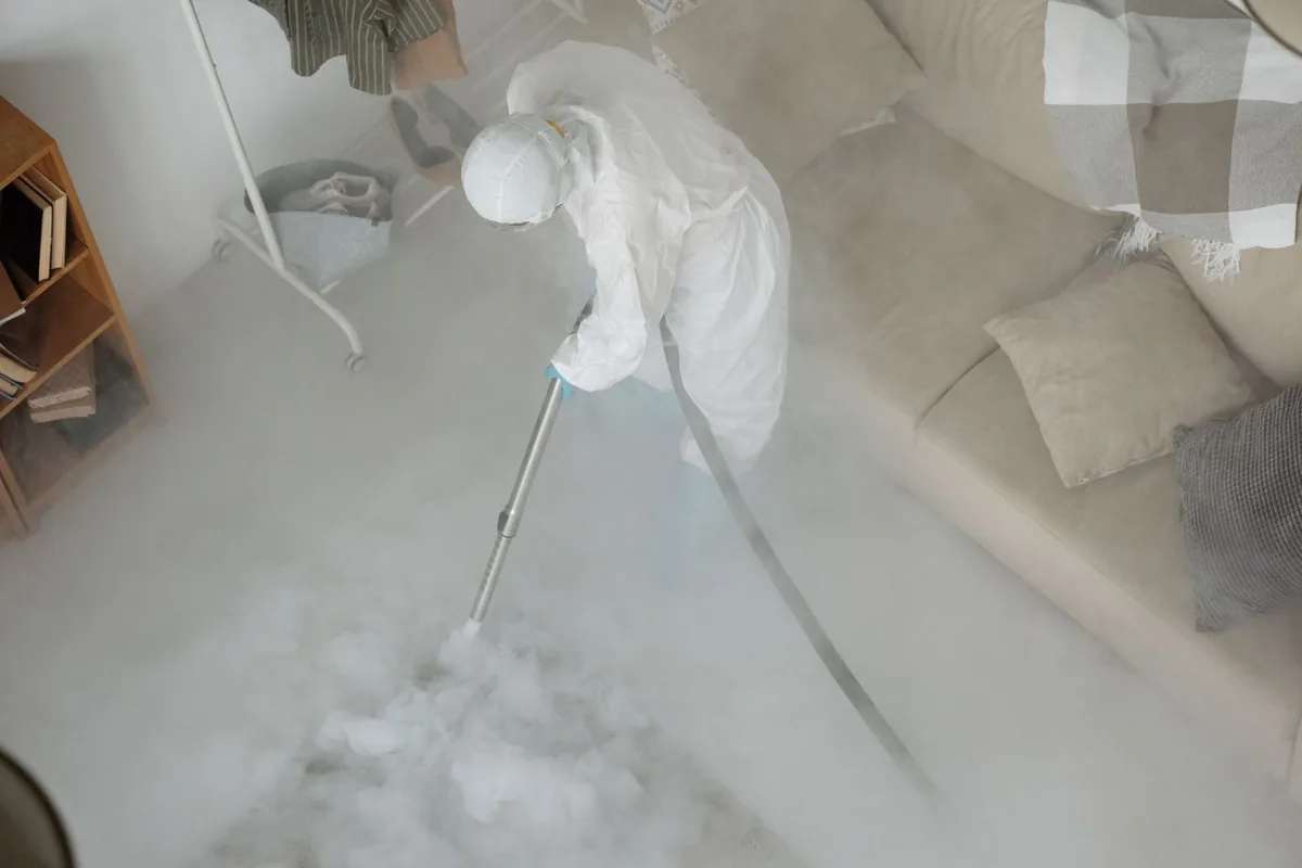 Biohazard cleanup technician in protective equipment, Green Park, MO